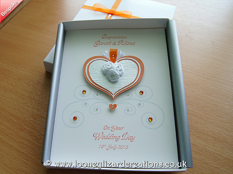 Orange and silver heart with ribbon roses and crystal detail