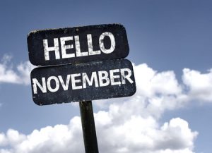 Sign with blue sky and clouds with hello november