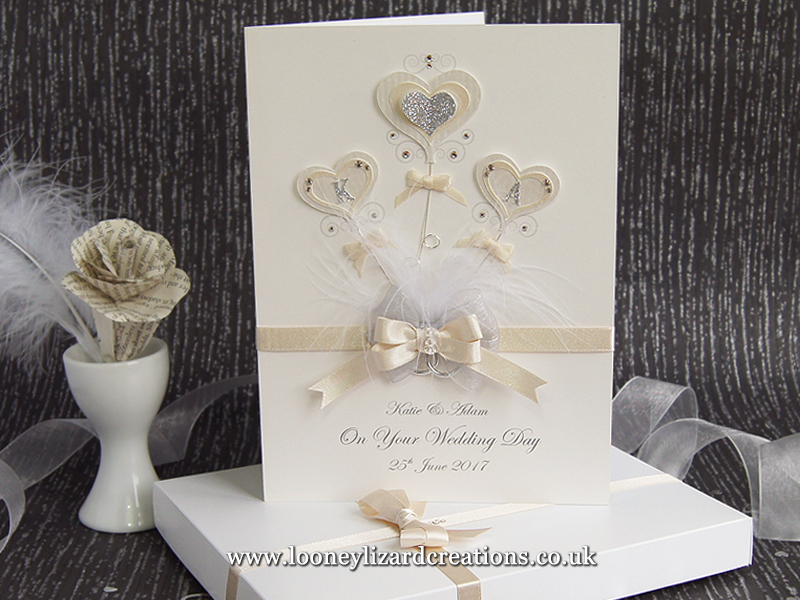 romantic wedding card with heart shaped balloons featuring the couples initials and embellished with crystals and glitter