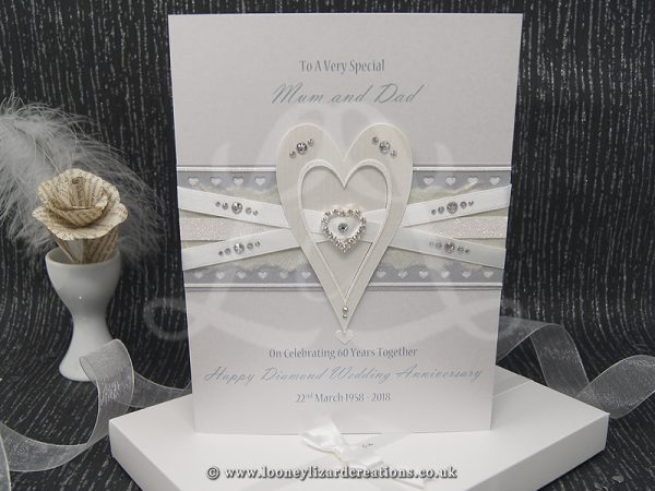 luxury card featuring an ivory heart embellished with white glitter and clear crystals.