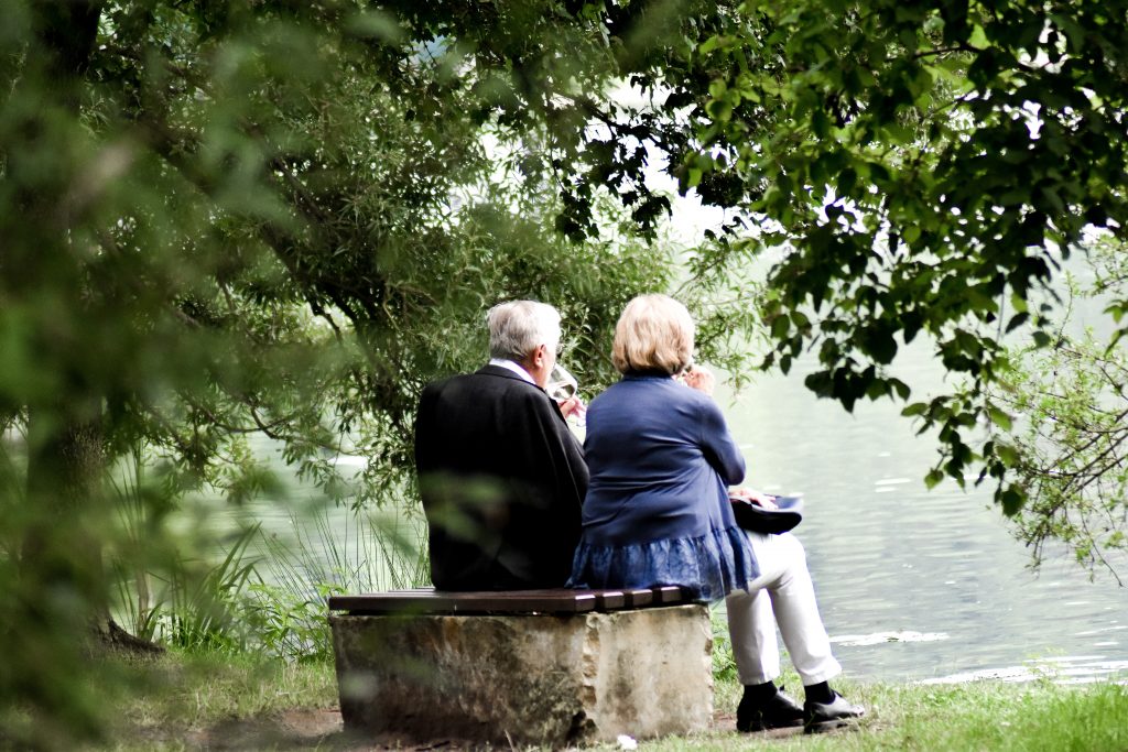 Mature couple sitting together and joying the view