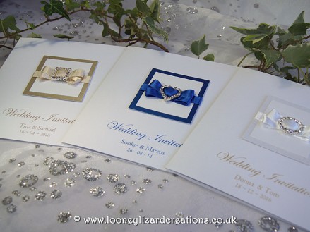 Beatrice Wedding Collection. Shown here (L to R) Mink with Square Embellishment, Royal Blue with Heart Embellishment and White (with gold sheen) and Oval Embellishment.