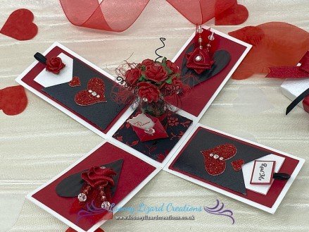 Enchanted - Features a romantic vase of half a dozen red roses with crystals centres. Including a charming little envelope with note ‘To My Valentine’.
