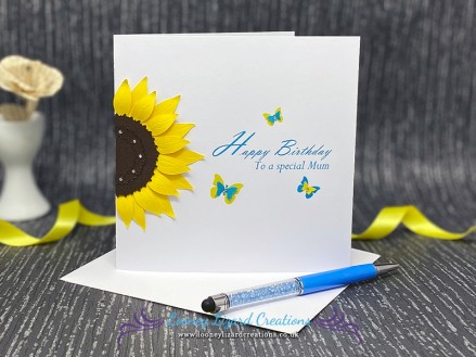 Solar - Featuring a sunflower and a trio of butterflies. A summery design in yellow and turquoise.