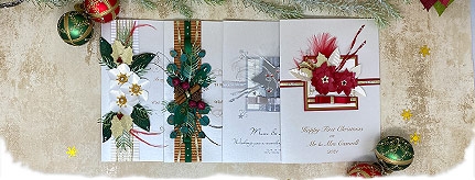 a selection of luxury christmas card featuring festive foliage and flowers