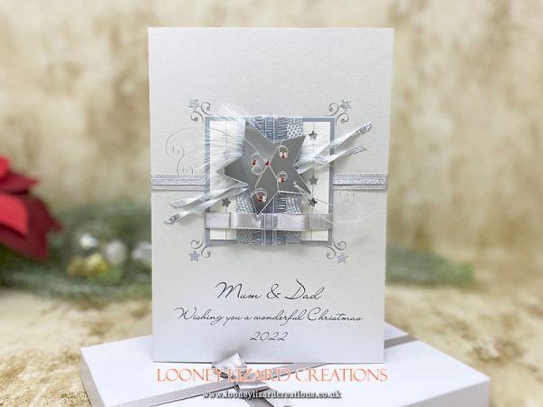 a celestial christmas card featuring silvery stars.