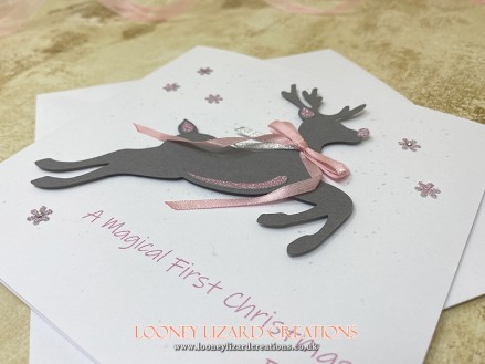 Rudolph: Featuring a leaping reindeer with glittery accents and trailing ribbon bow