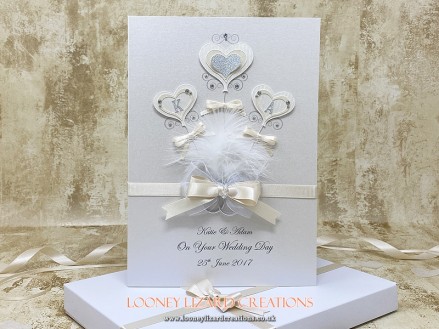 Bouquet - Featuring an opulent bouquet of heart shaped balloons, embellished with entwined wedding rings, glitter and crystals