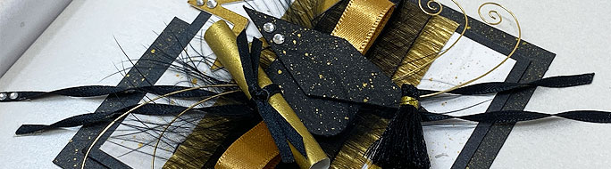 close up of new design accolade the gradution card in black and gold with graduation cap