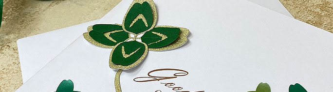 lucky four leafed clover in gold and green