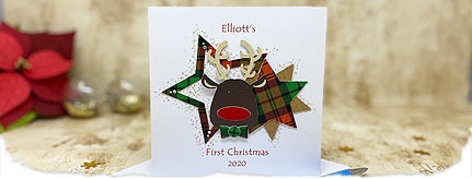 babys first christmas card with a cute reindeer