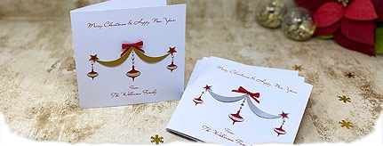 Christmas card pack with gold swag with decorated baubles